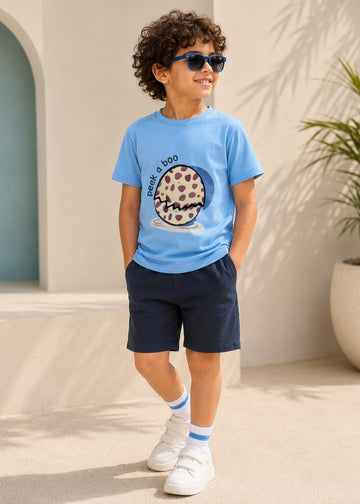 Boy in a ColT & KiN tee and shorts