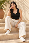 Notch Neck Rib Crop Top in Jet Black – seated on steps