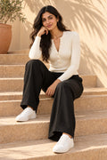 Rib Henley Button Long Sleeve Top in Coconut Milk – seated on steps